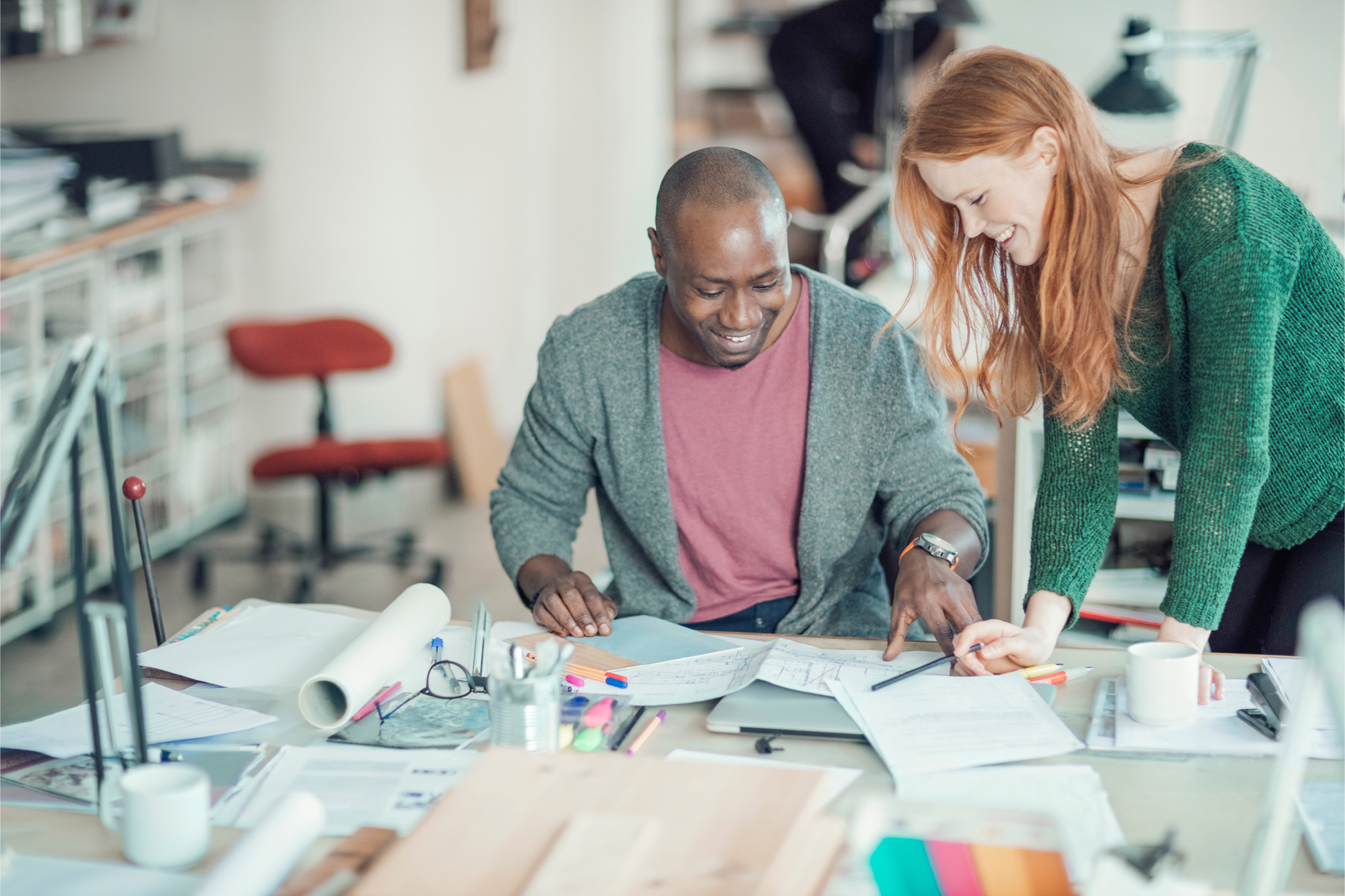 Business owners looking over blue prints